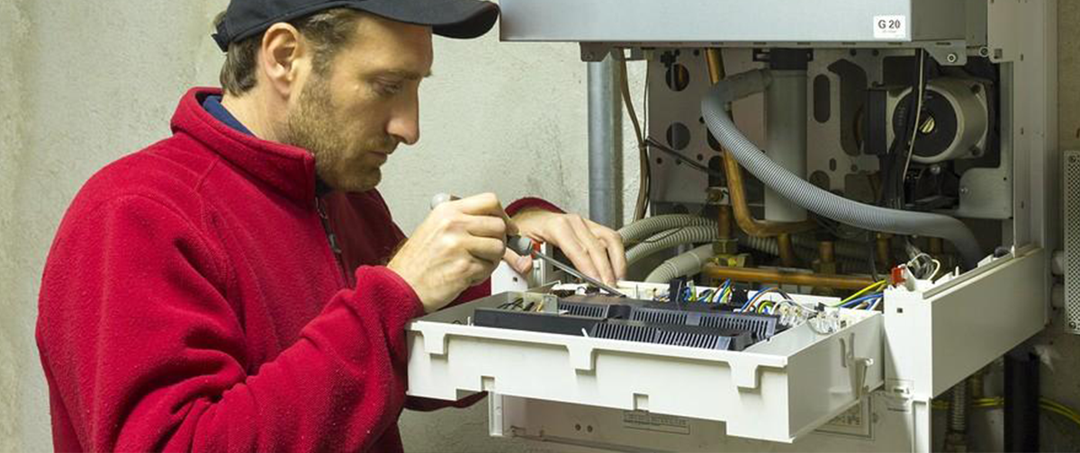 Gas Safe Engineer working on boiler